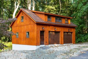 wood stained board and batten two story garage